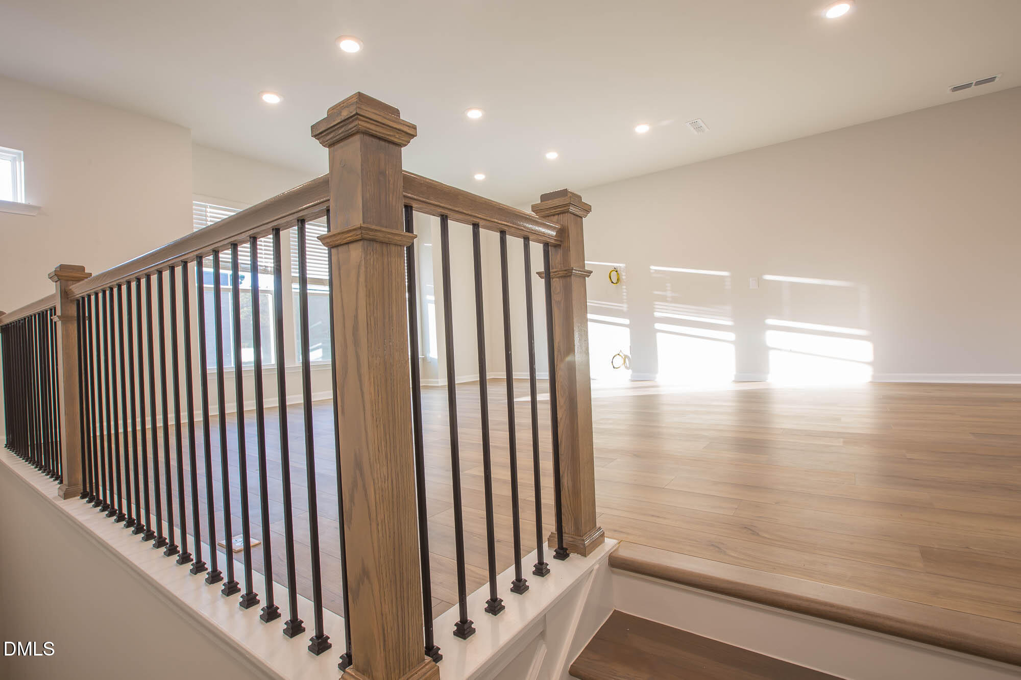765 Larkspur Bowl Way Apex, NC 27523 - Photo 6 of 25 a view of hallway with stairs