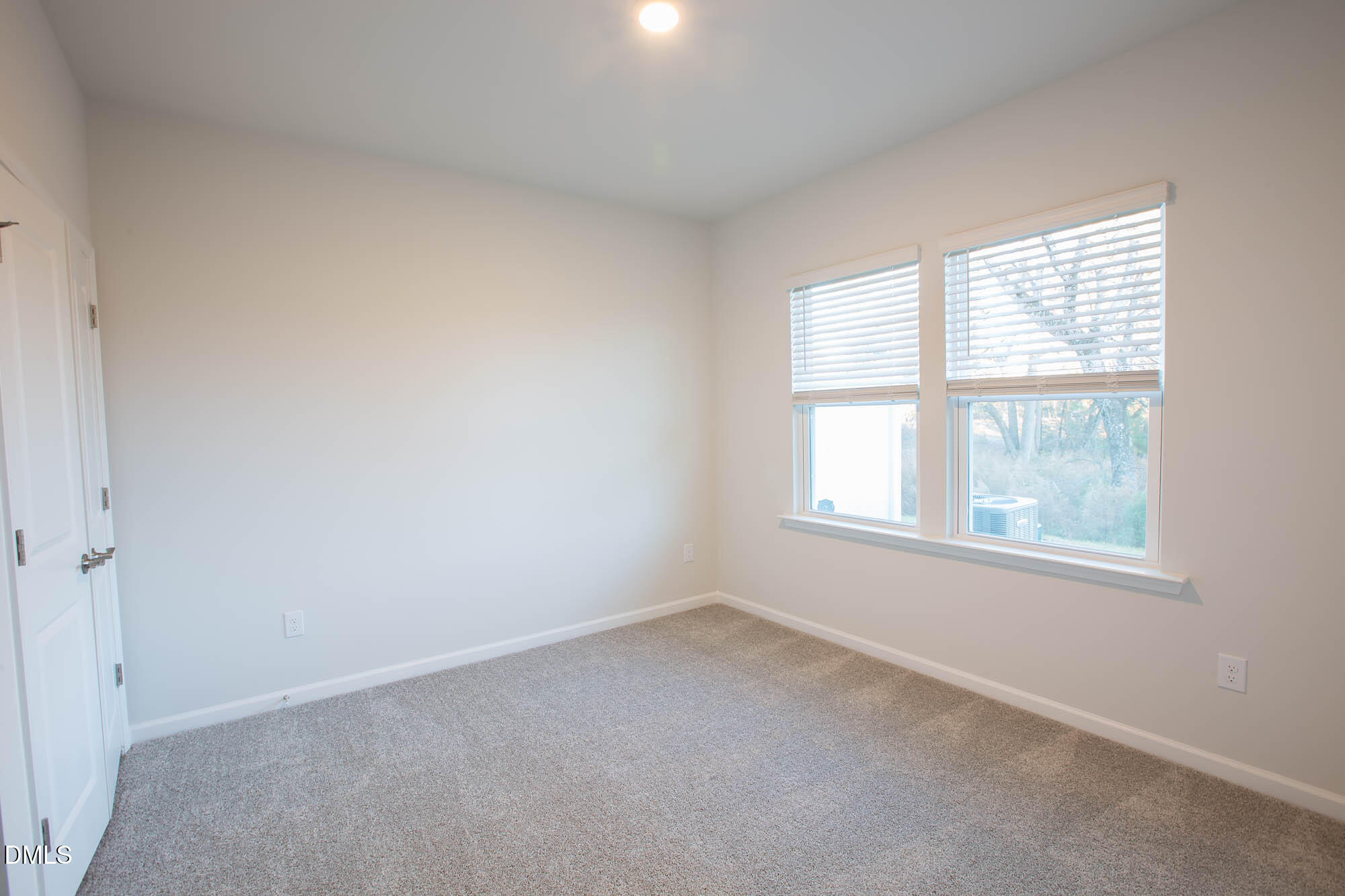 765 Larkspur Bowl Way Apex, NC 27523 - Photo 9 of 25 an empty room with a window