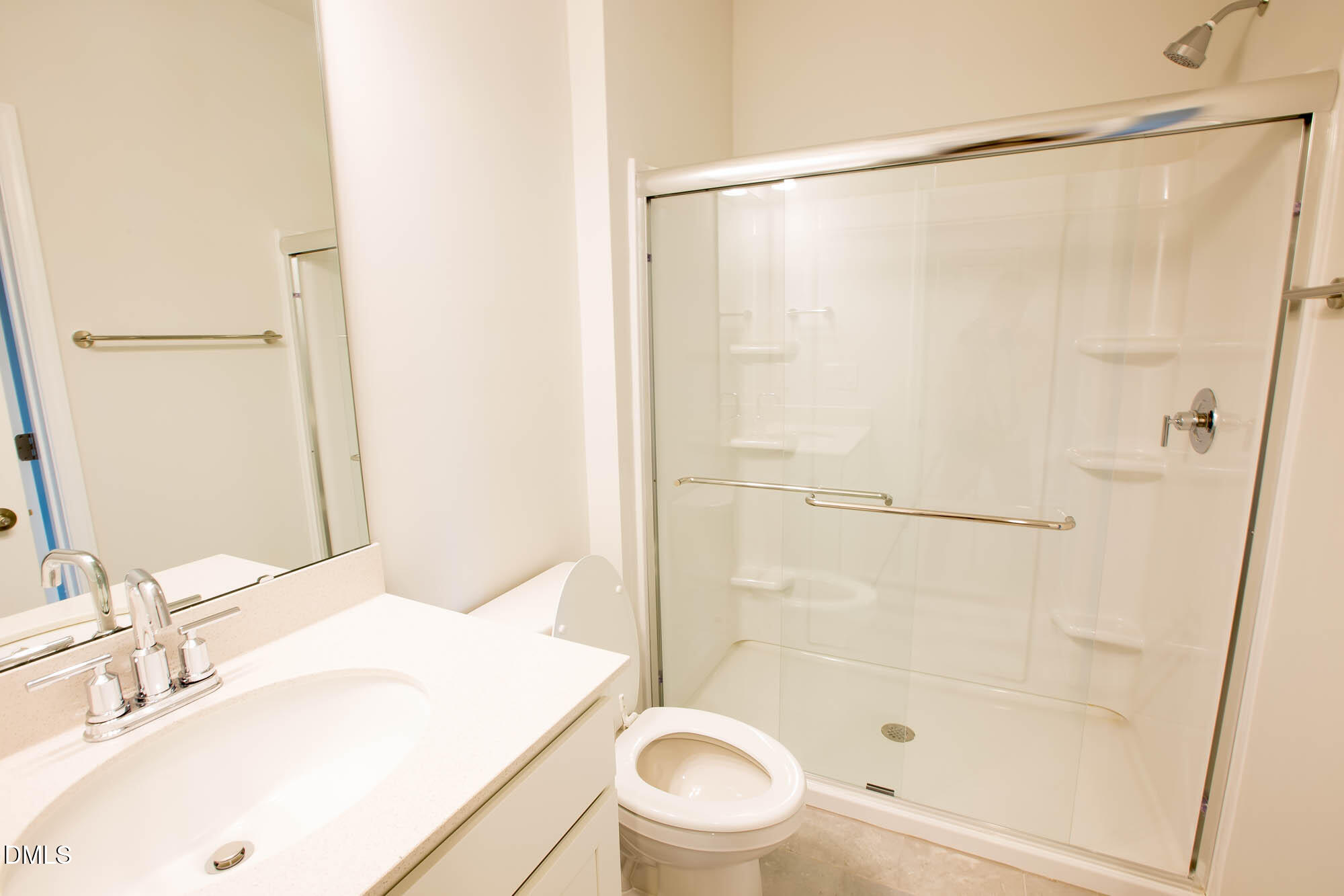 765 Larkspur Bowl Way Apex, NC 27523 - Photo 10 of 25 a bathroom with a sink and a mirror