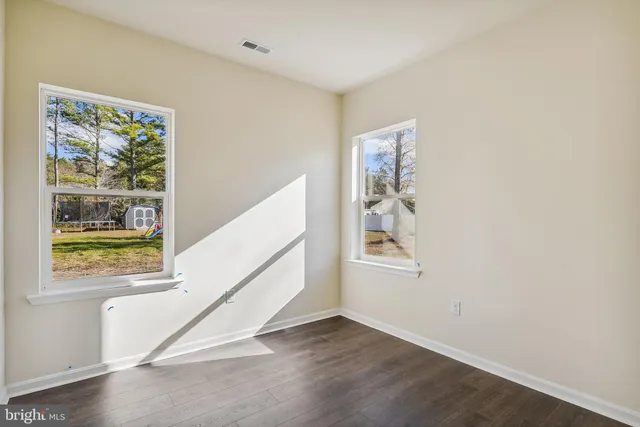 a view of an entryway with wooden floor