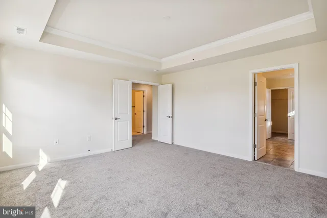 a view of an empty room and a window