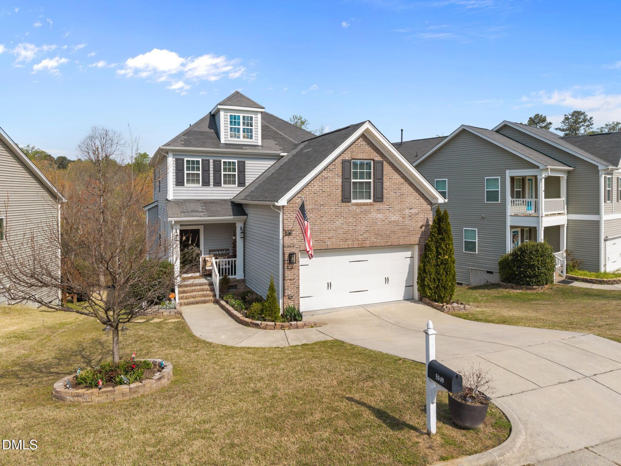 5049 Jelynn Street Raleigh, NC 27616 - Photo 2 of 33 a front view of a house with a yard