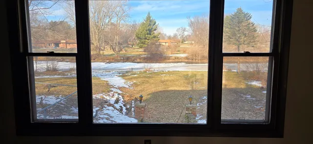 a house with a tree in front of it