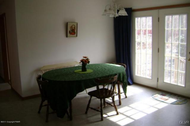 712 Johns Road Effort, PA 18330 - Photo 3 of 6 a view of a dining room with a table and chairs