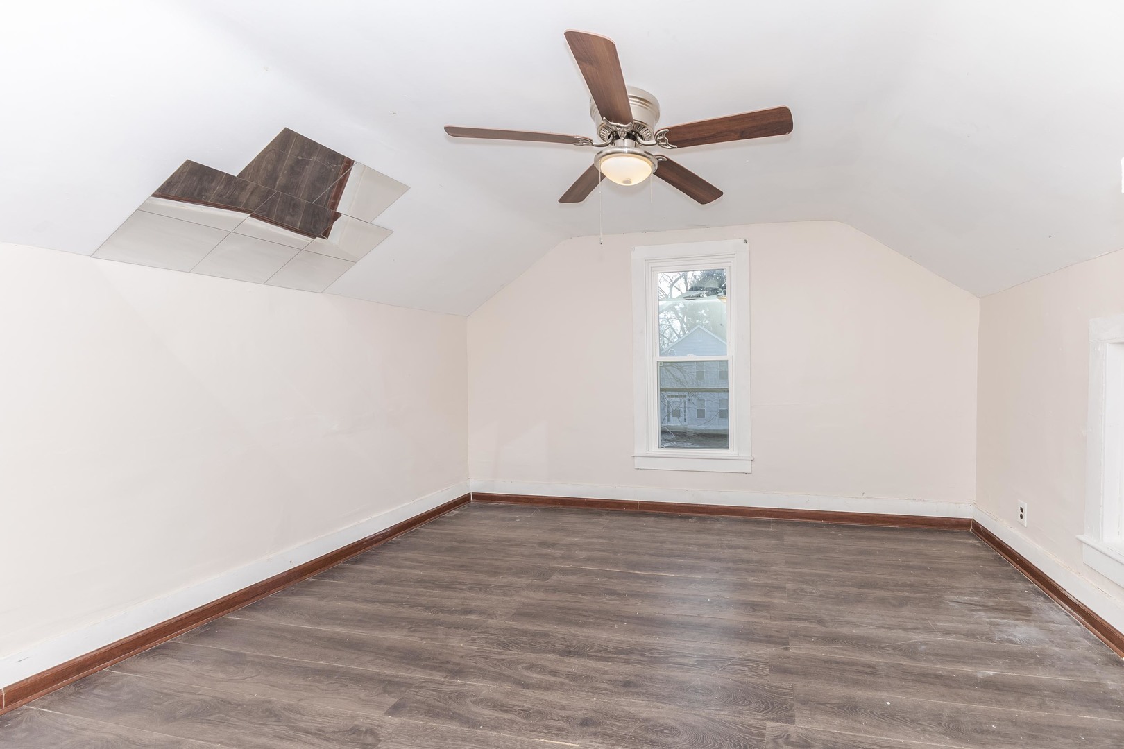 121 East James Street Forrest, IL 61741 - Photo 18 of 39 a view of room window and wooden floor
