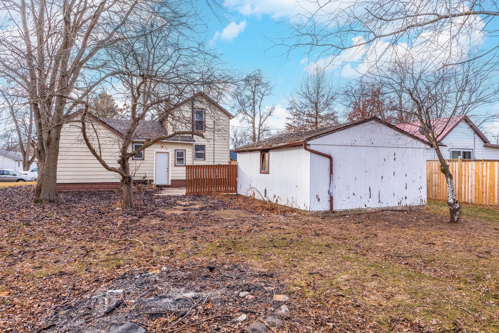 121 East James Street Forrest, IL 61741 - Photo 24 of 39 a front view of a house with a yard and tree