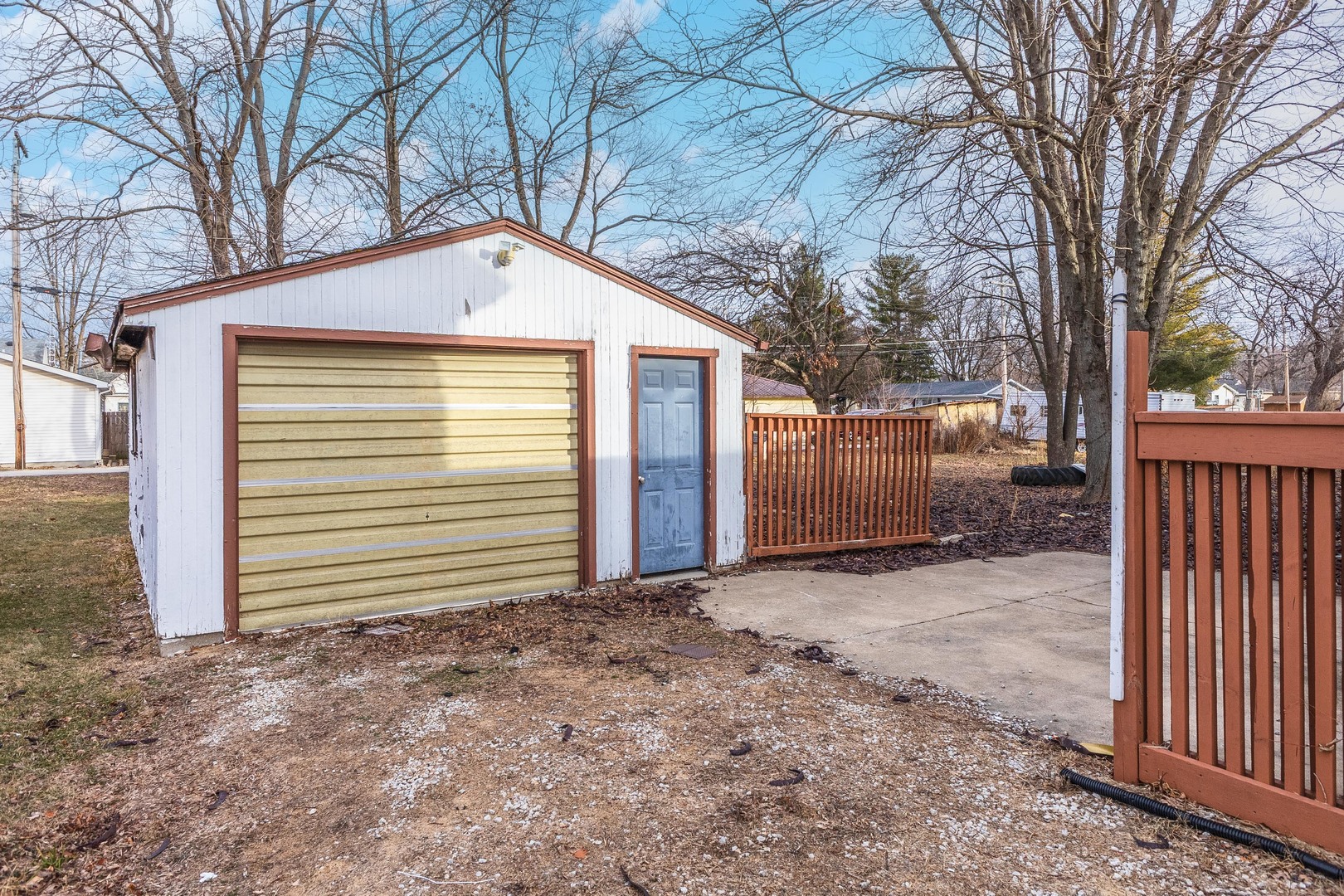 121 East James Street Forrest, IL 61741 - Photo 25 of 39 a front view of a house with a yard and garage
