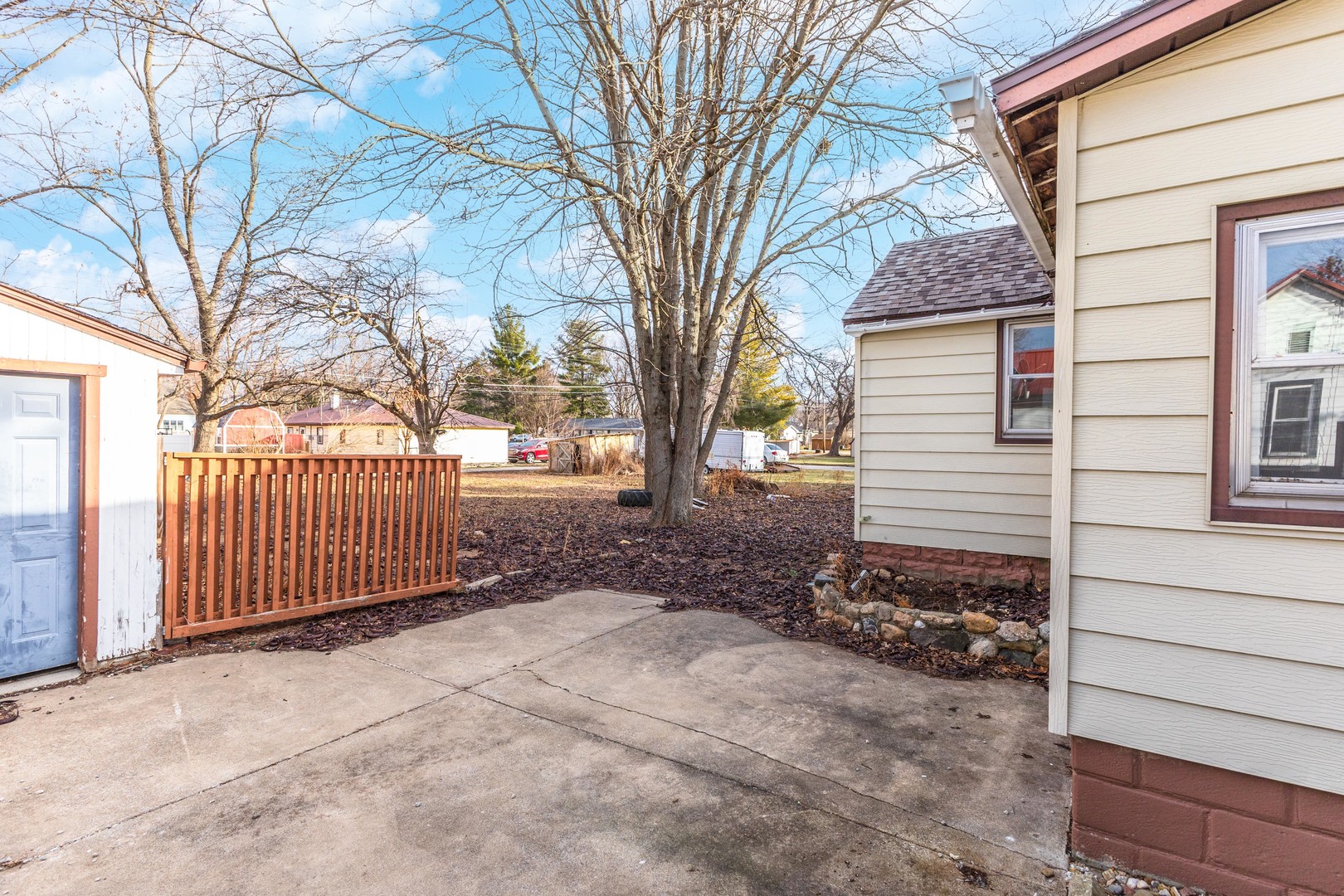 121 East James Street Forrest, IL 61741 - Photo 26 of 39 a view of a porch with a bench and wooden fence
