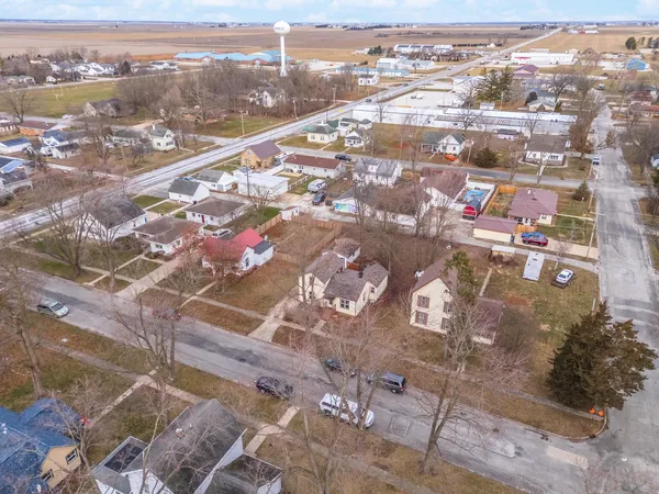 an aerial view of residential houses with outdoor space