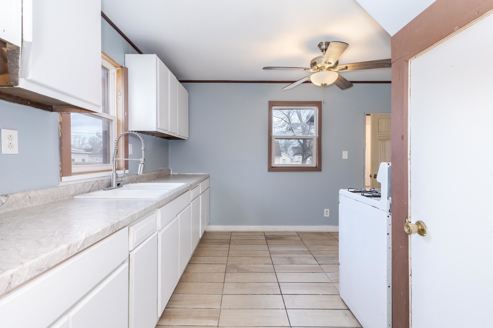 121 East James Street Forrest, IL 61741 - Photo 9 of 39 a kitchen with a sink cabinets and window
