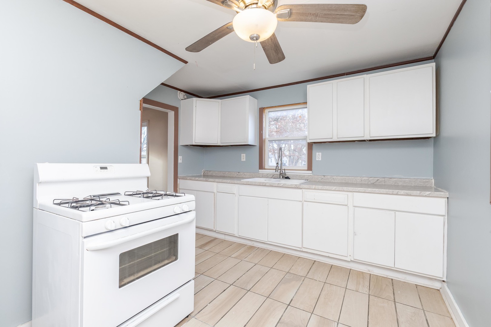 121 East James Street Forrest, IL 61741 - Photo 10 of 39 a kitchen with cabinets appliances and a sink