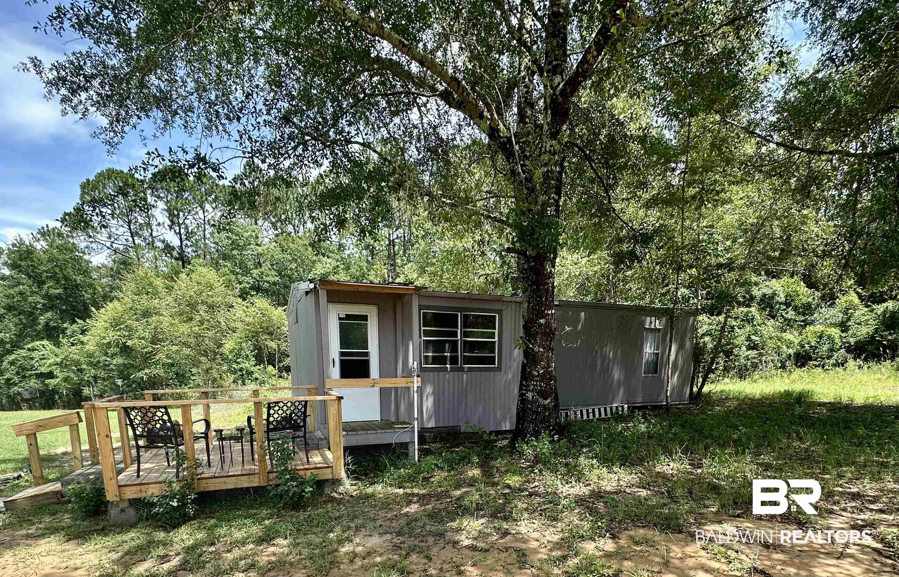 21305 River Road Robertsdale, AL 36567 - Photo 42 of 50 Rear view of property with an outdoor structure and a deck