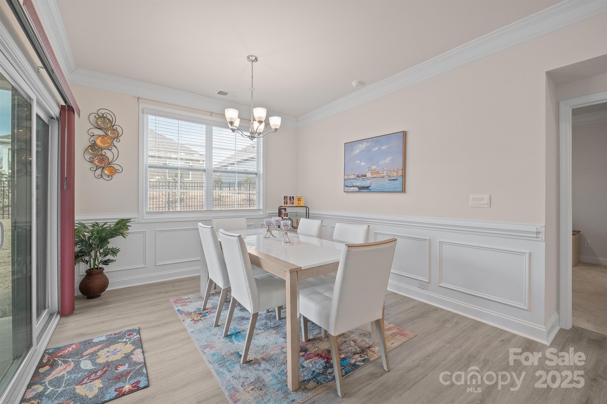 106 South Shayna Road Troutman, NC 28166 - Photo 14 of 41 a view of a dining room with furniture window and wooden floor