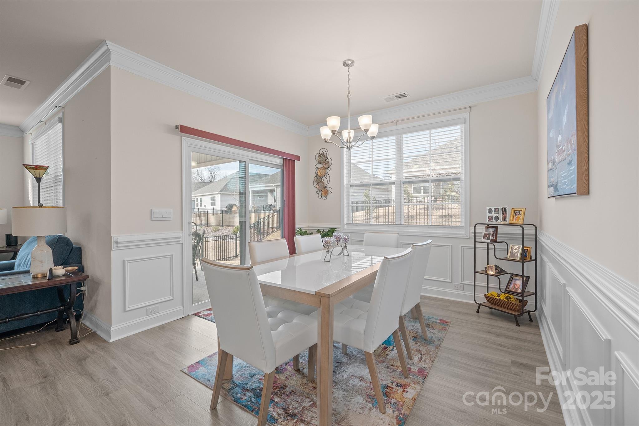 106 South Shayna Road Troutman, NC 28166 - Photo 15 of 41 a dining room with furniture a chandelier and wooden floor