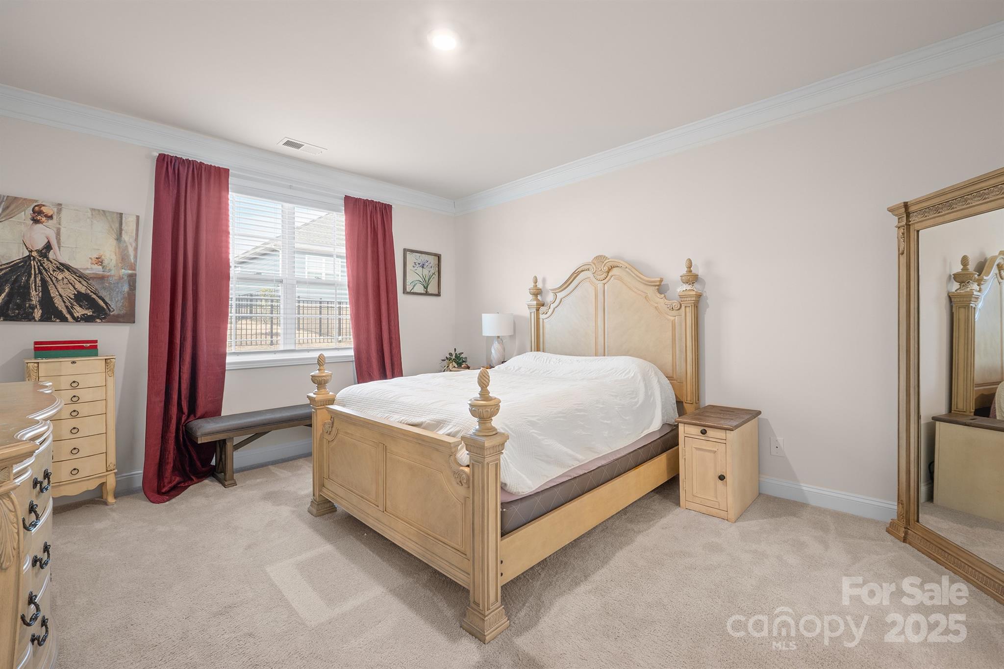 106 South Shayna Road Troutman, NC 28166 - Photo 17 of 41 a bed sitting in a spacious bedroom next to a window