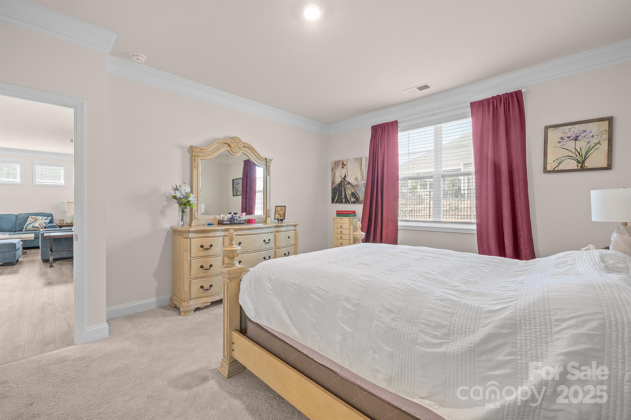 106 South Shayna Road Troutman, NC 28166 - Photo 18 of 41 a bedroom with a bed and dresser with mirror