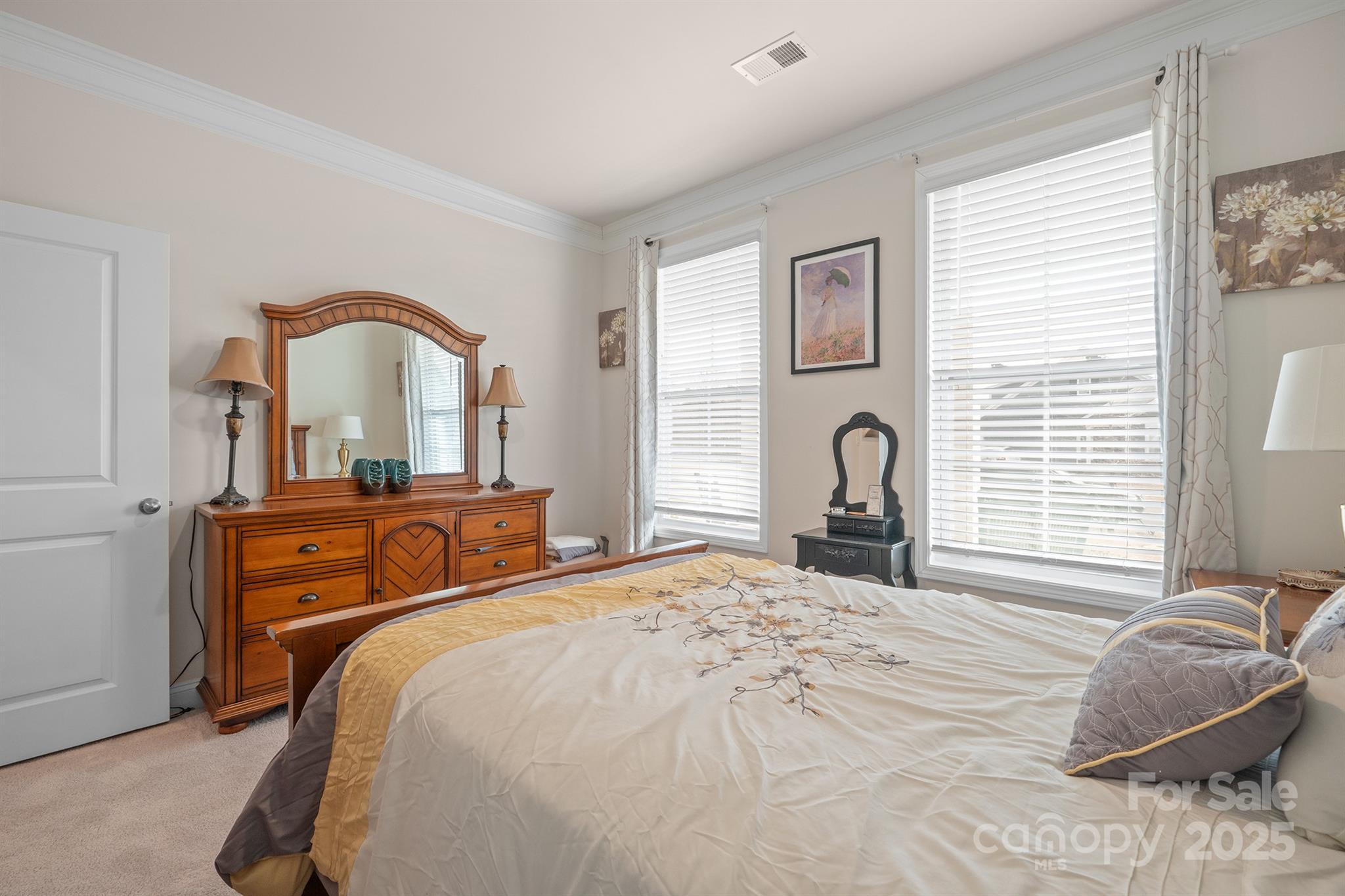 106 South Shayna Road Troutman, NC 28166 - Photo 25 of 41 a bedroom with a bed and a large window