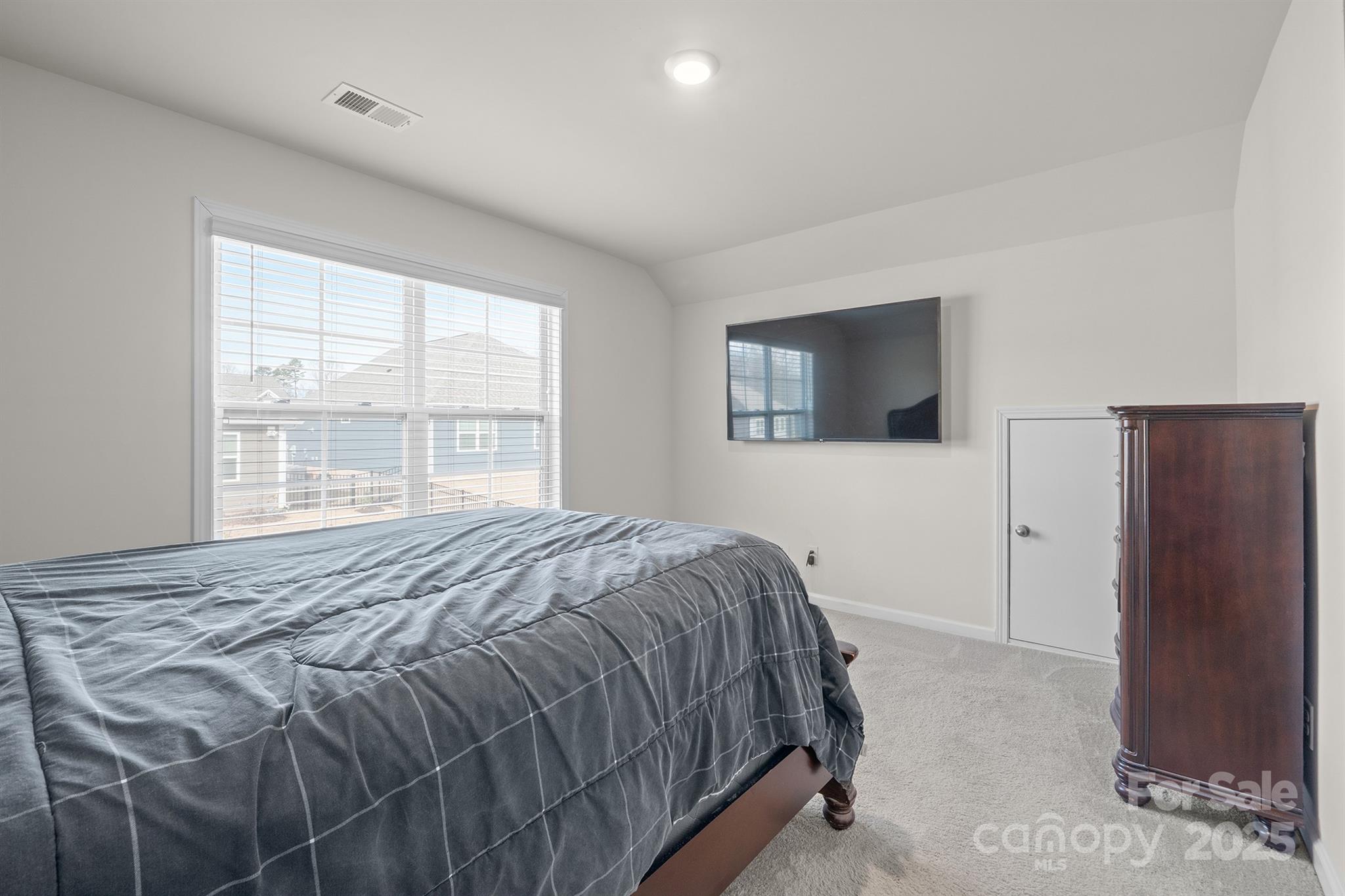 106 South Shayna Road Troutman, NC 28166 - Photo 32 of 41 a bedroom with a bed and a window