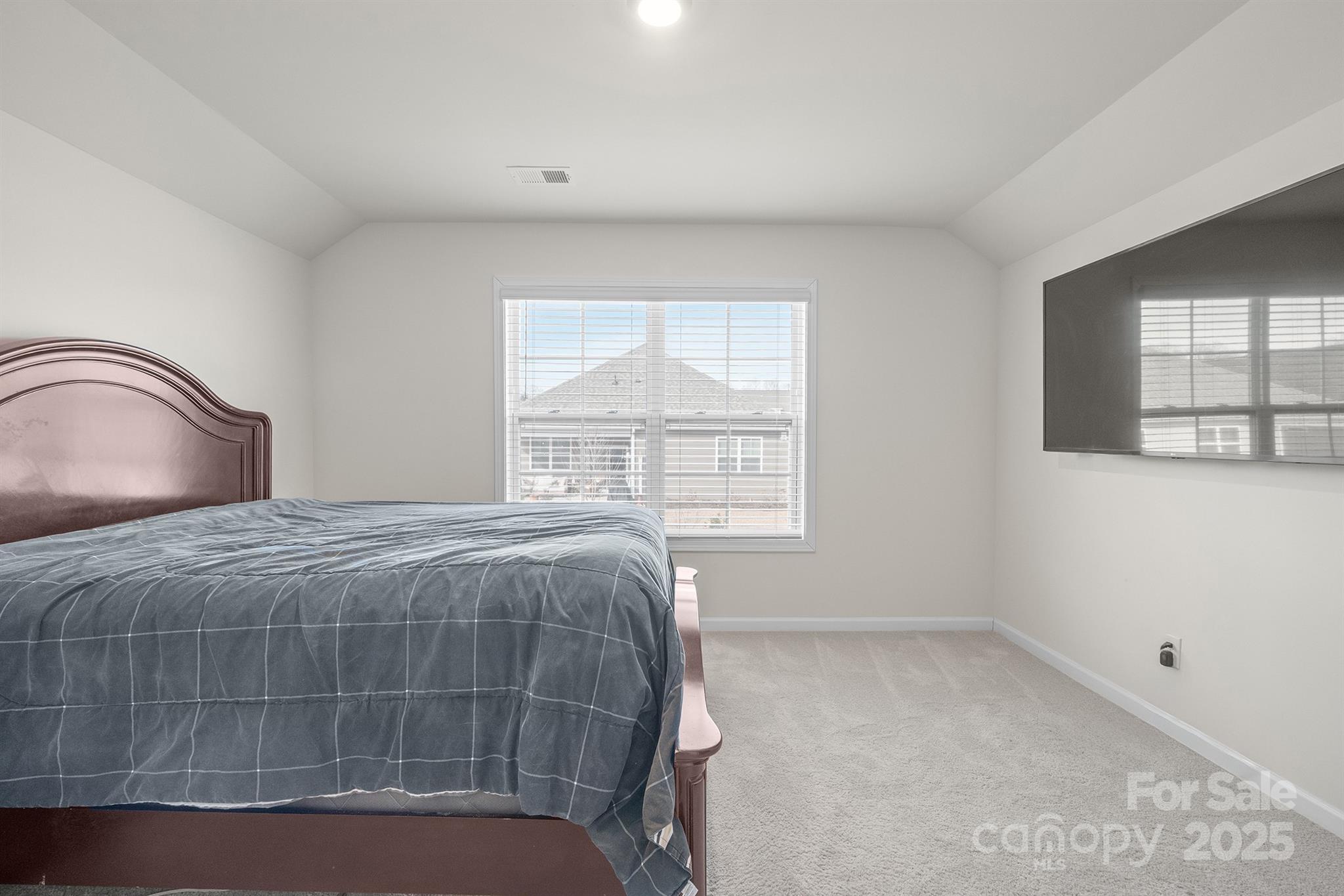 106 South Shayna Road Troutman, NC 28166 - Photo 35 of 41 a bedroom with a bed and a window