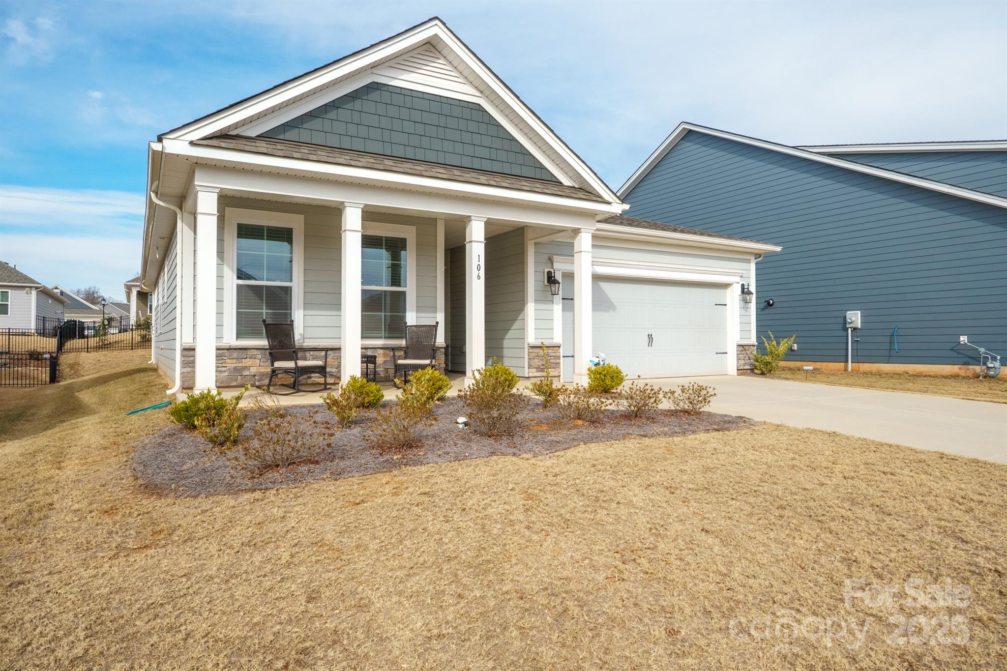 106 South Shayna Road Troutman, NC 28166 - Photo 4 of 41 a front view of a house with a yard