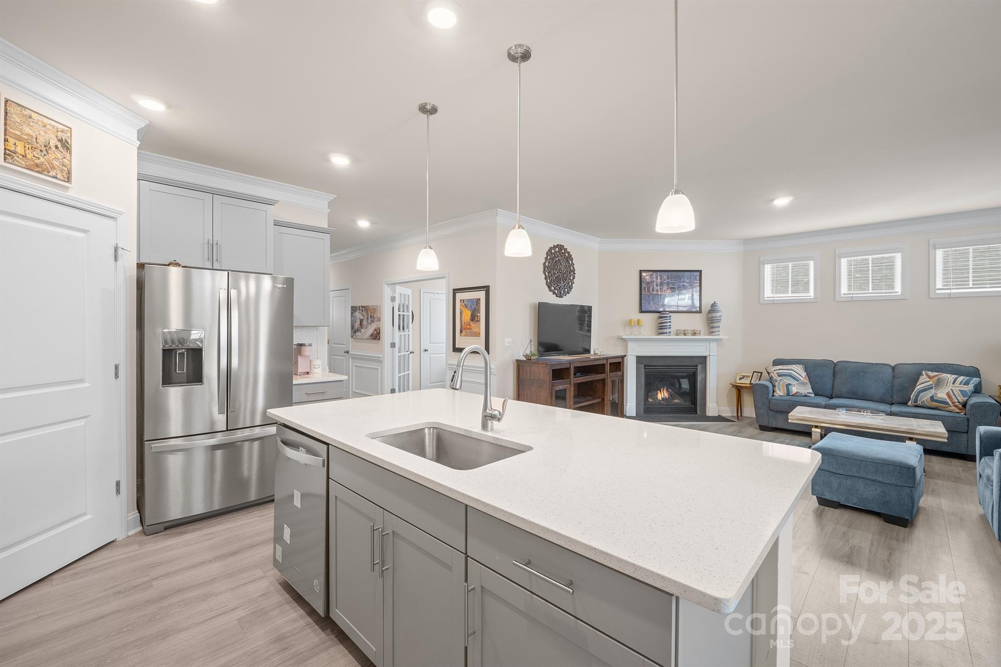 106 South Shayna Road Troutman, NC 28166 - Photo 7 of 41 a kitchen with stainless steel appliances kitchen island a refrigerator and a sink