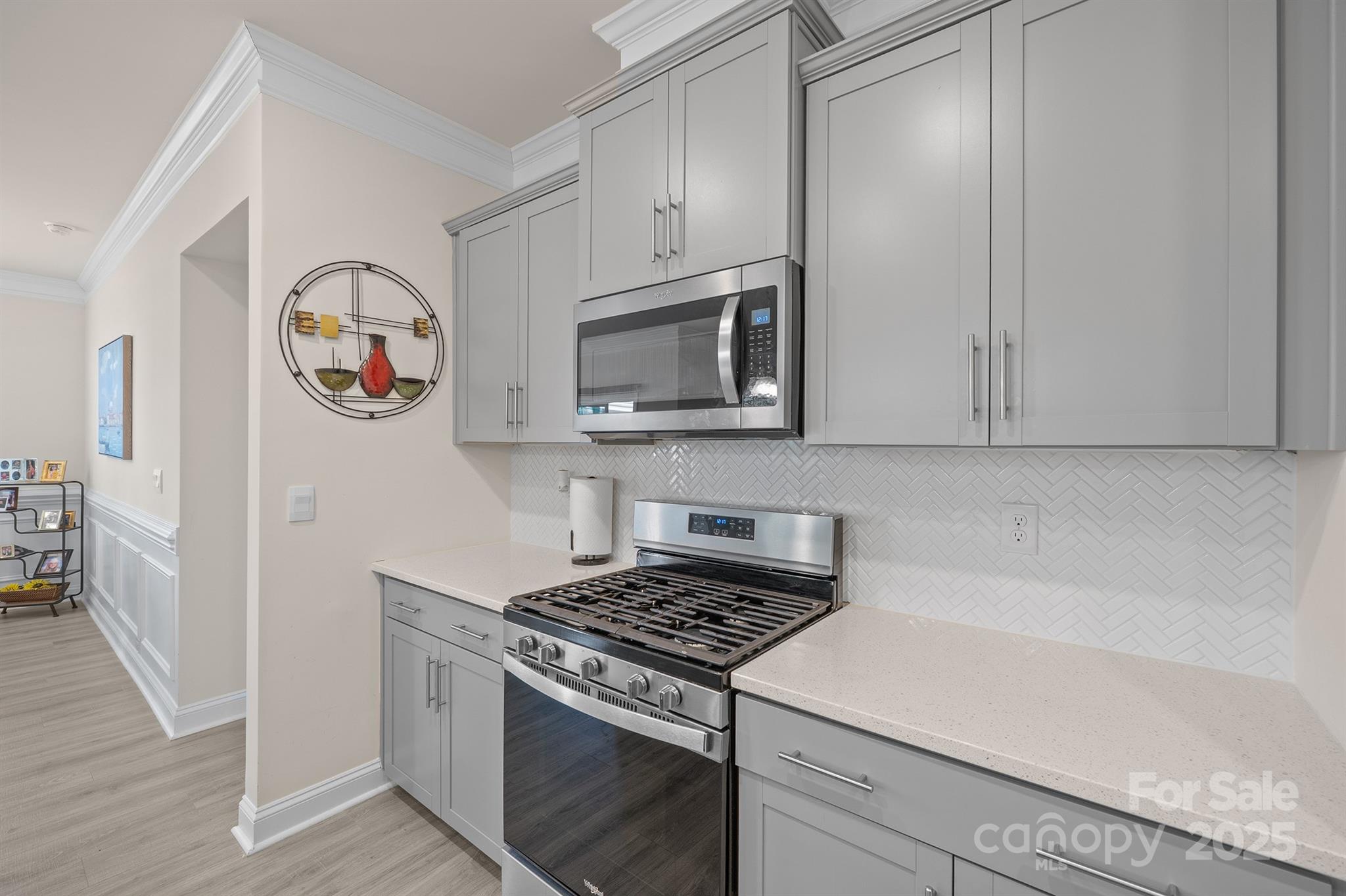 106 South Shayna Road Troutman, NC 28166 - Photo 8 of 41 a kitchen with cabinets and steel stainless steel appliances