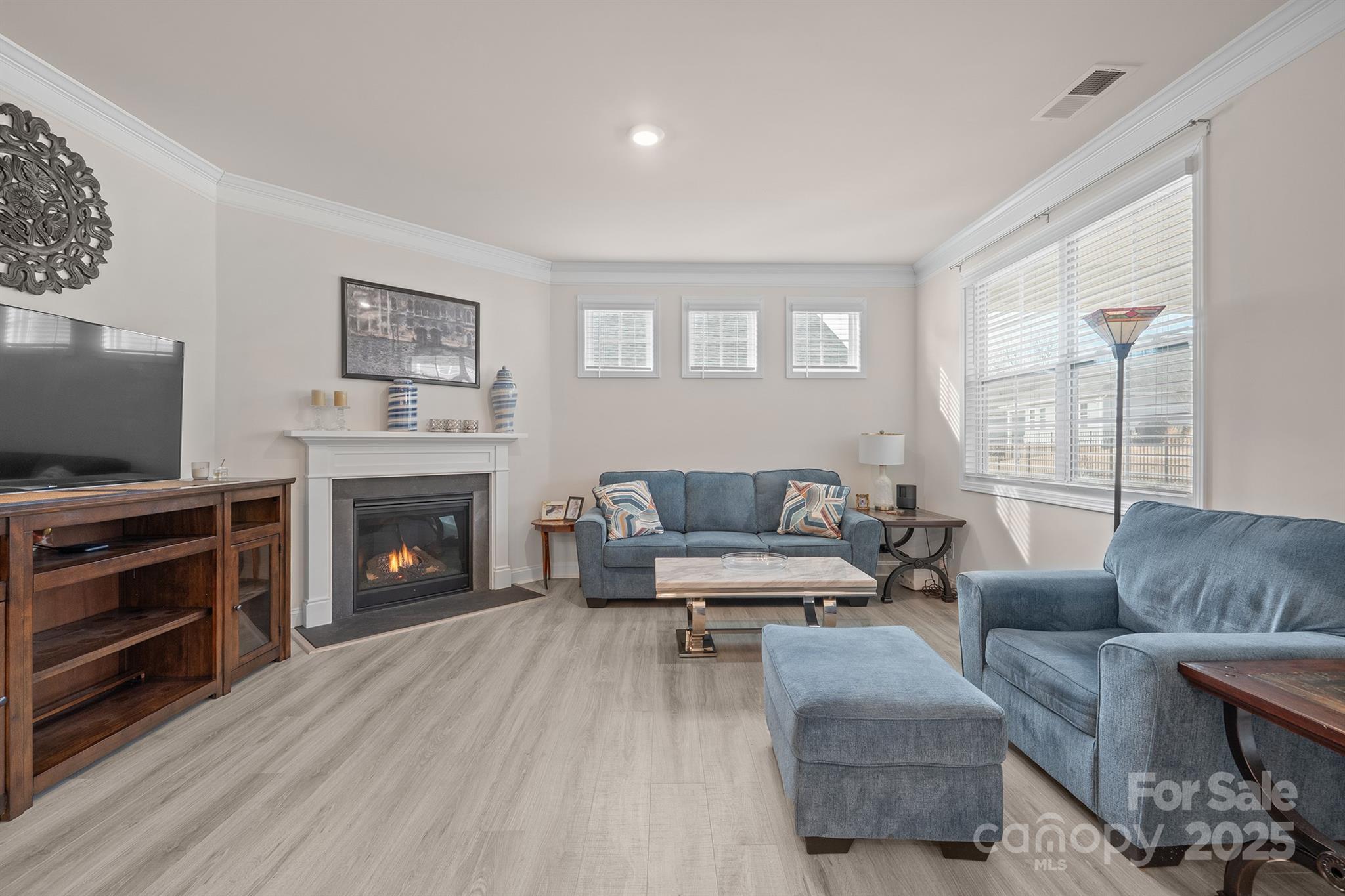 106 South Shayna Road Troutman, NC 28166 - Photo 10 of 41 a living room with furniture and a fireplace