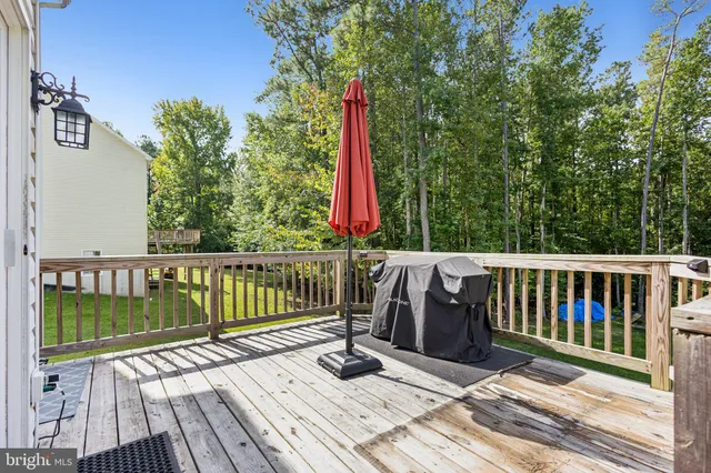 a view of a wooden deck with a bench