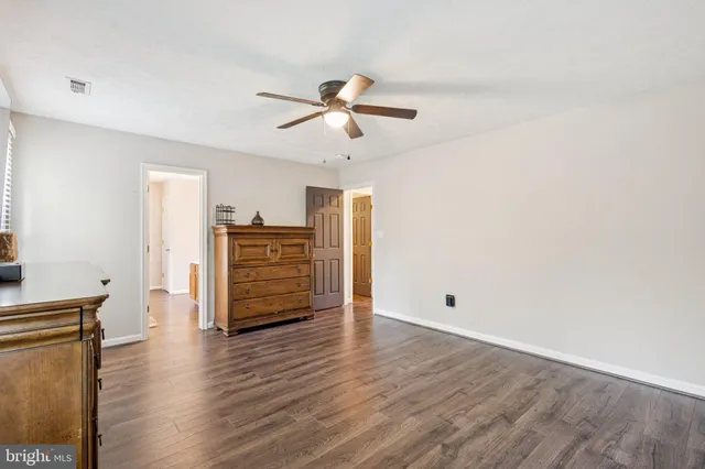 a view of a livingroom with wooden floor