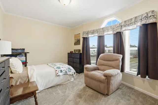 a bedroom with bed and a couch