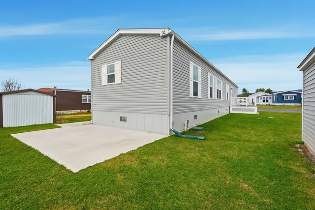 a view of backyard with a garden and deck