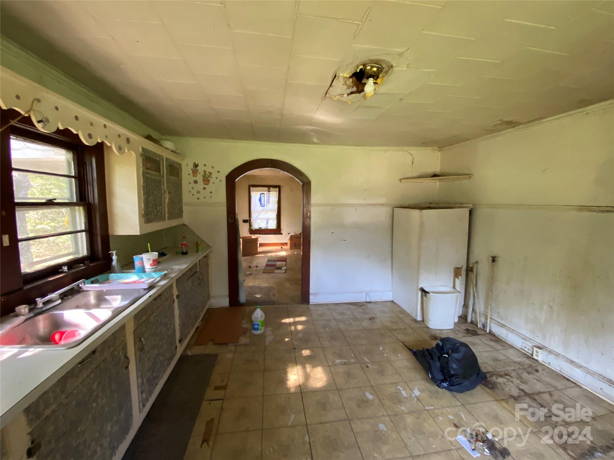 3140 Rutherford College Road Valdese, NC 28690 - Photo 17 of 40 a kitchen with stainless steel appliances a sink stove and cabinets