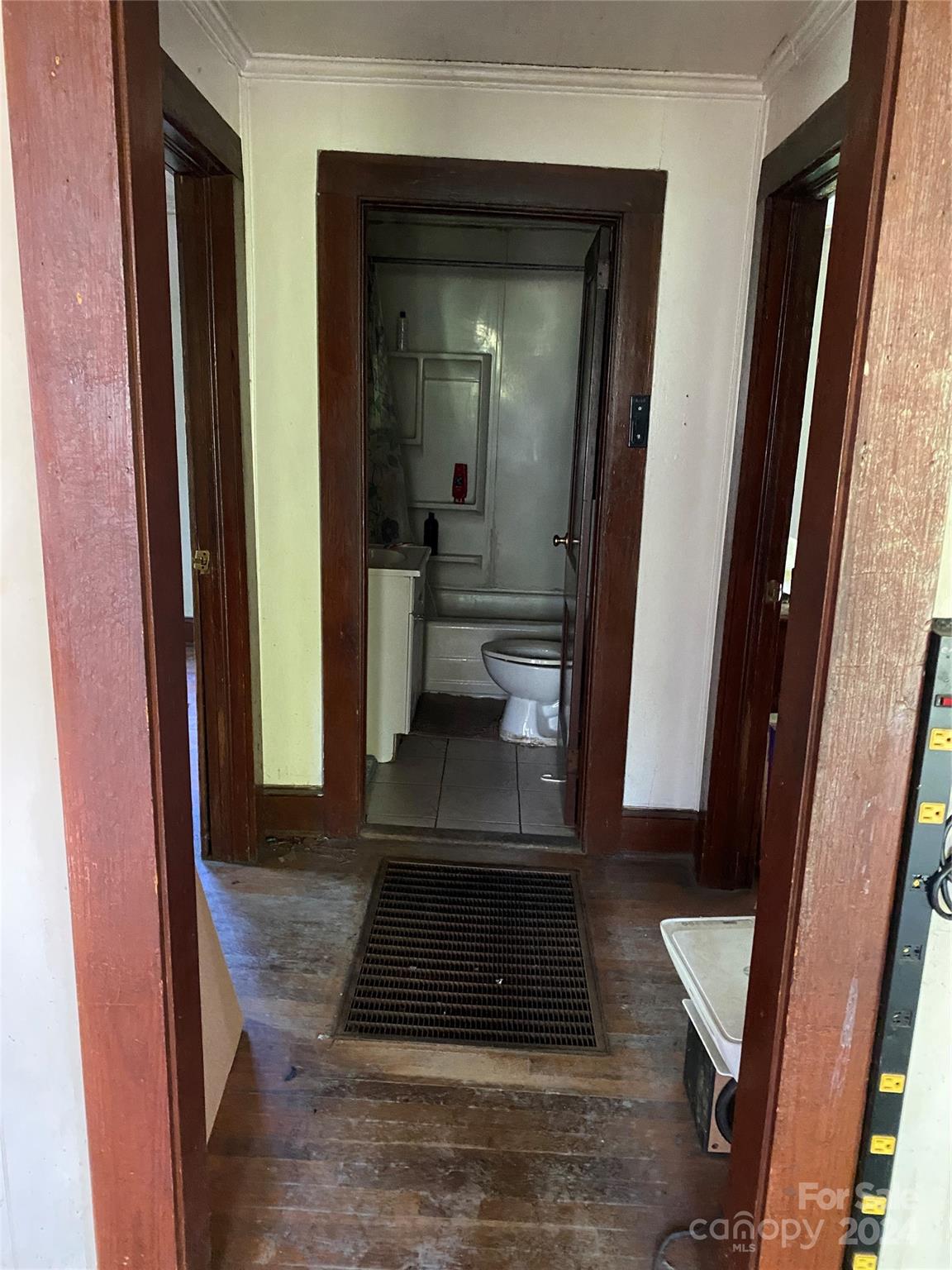 3140 Rutherford College Road Valdese, NC 28690 - Photo 19 of 40 a view of a hallway with wooden floor and a living room