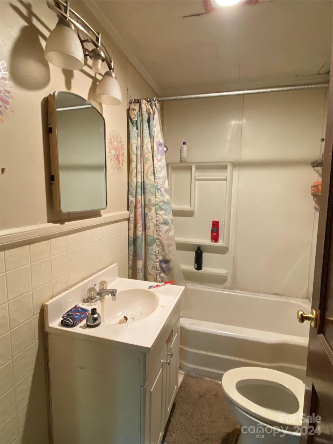 3140 Rutherford College Road Valdese, NC 28690 - Photo 25 of 40 a bathroom with a sink and a mirror