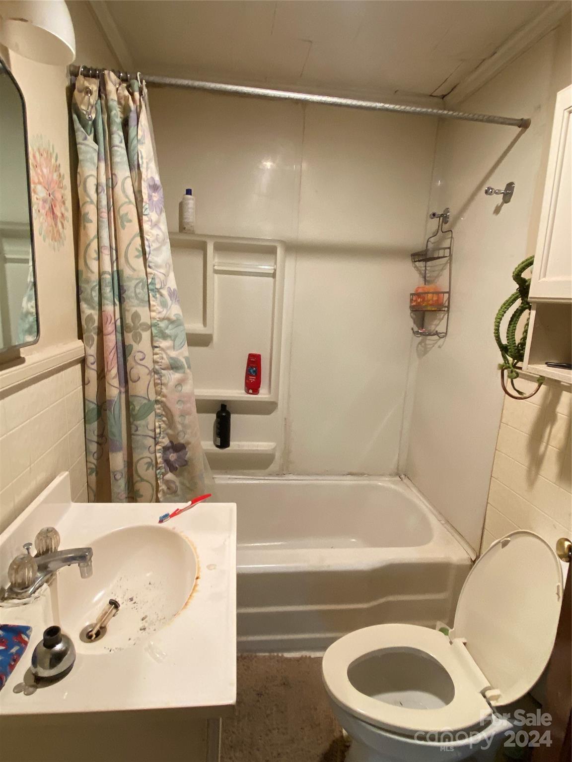 3140 Rutherford College Road Valdese, NC 28690 - Photo 26 of 40 a bathroom with a sink a toilet and a bathtub