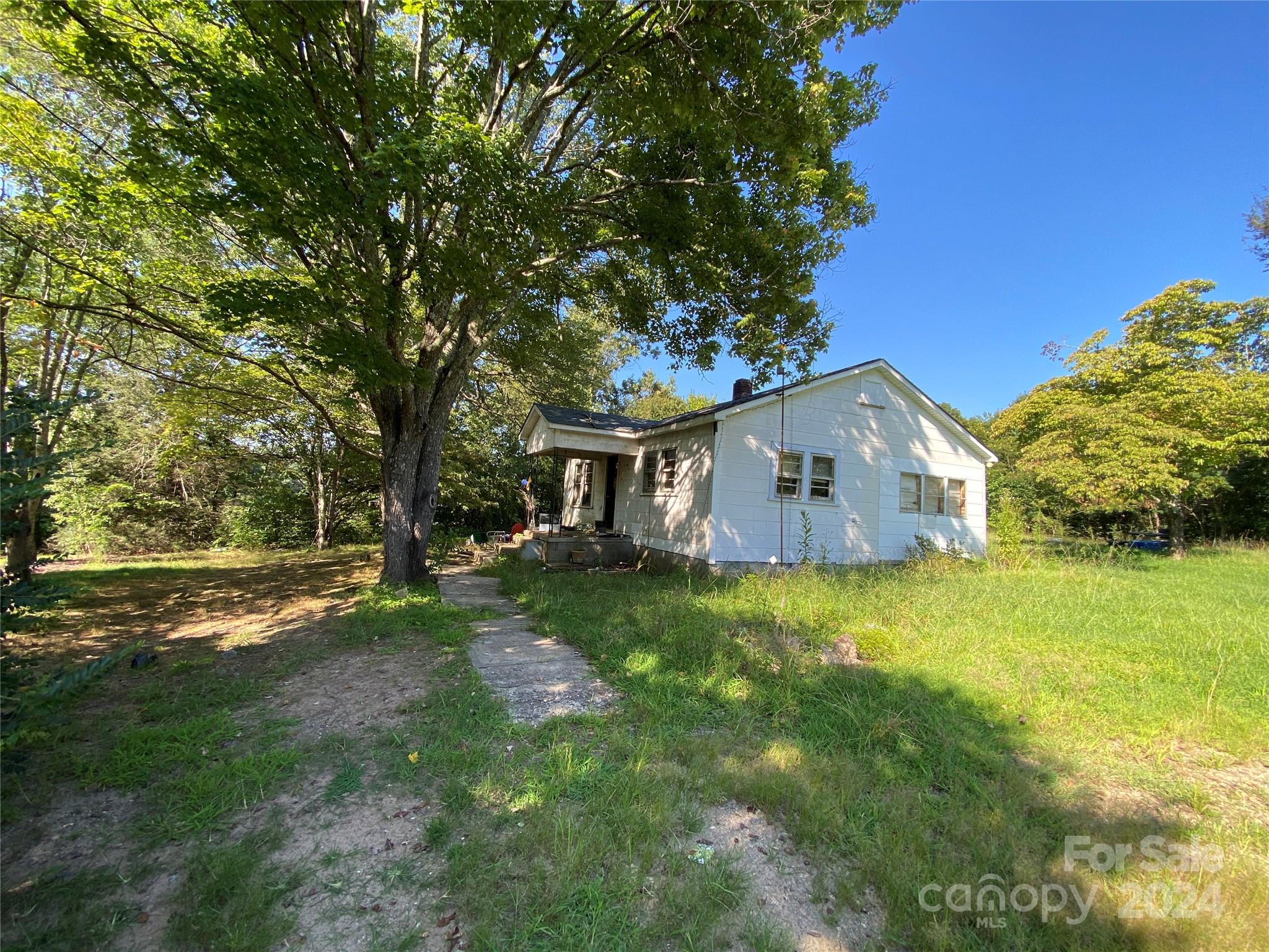 3140 Rutherford College Road Valdese, NC 28690 - Photo 31 of 40 a house view with a garden space