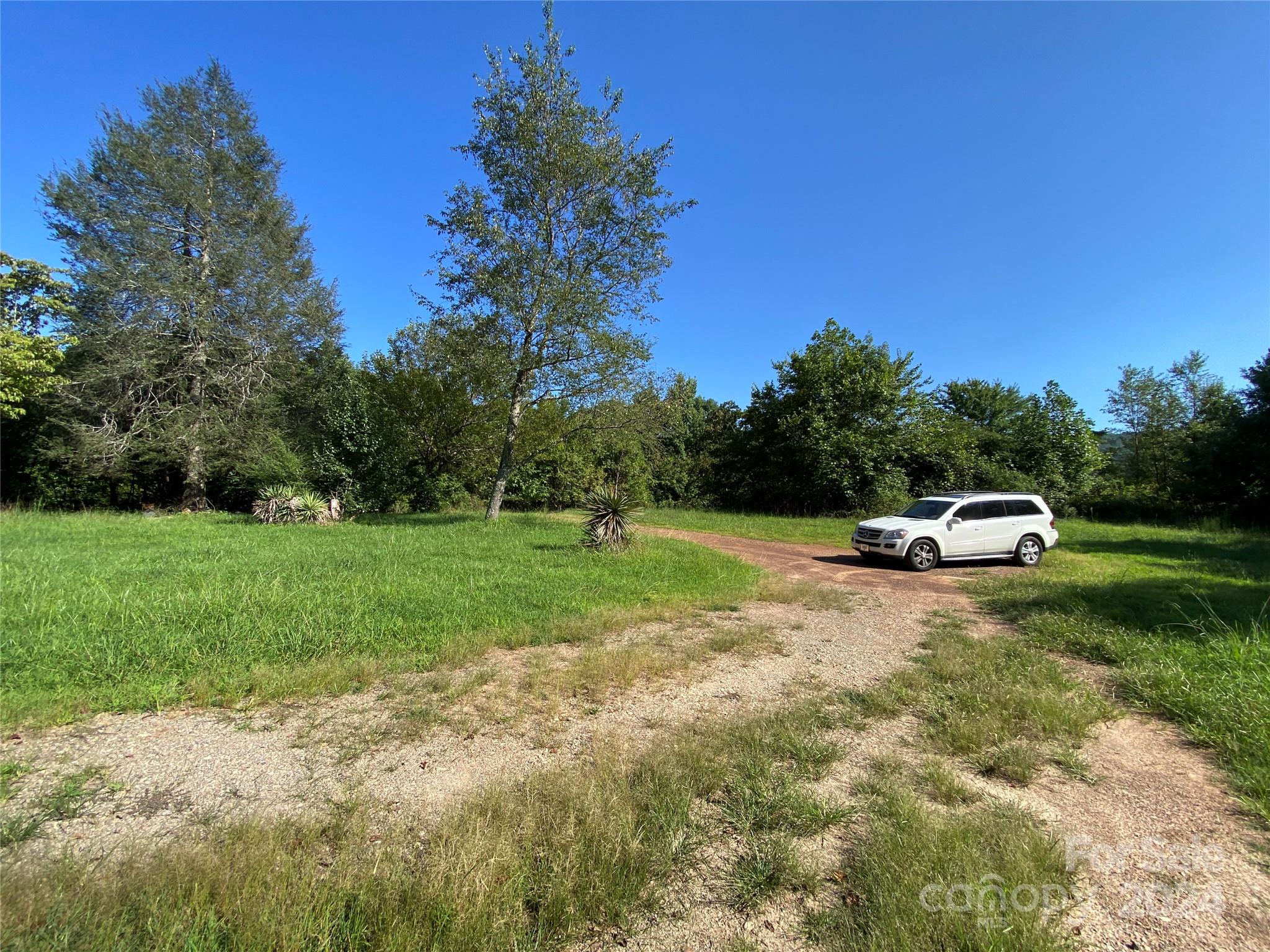 3140 Rutherford College Road Valdese, NC 28690 - Photo 33 of 40 a swimming pool is sitting in the grass near a yard