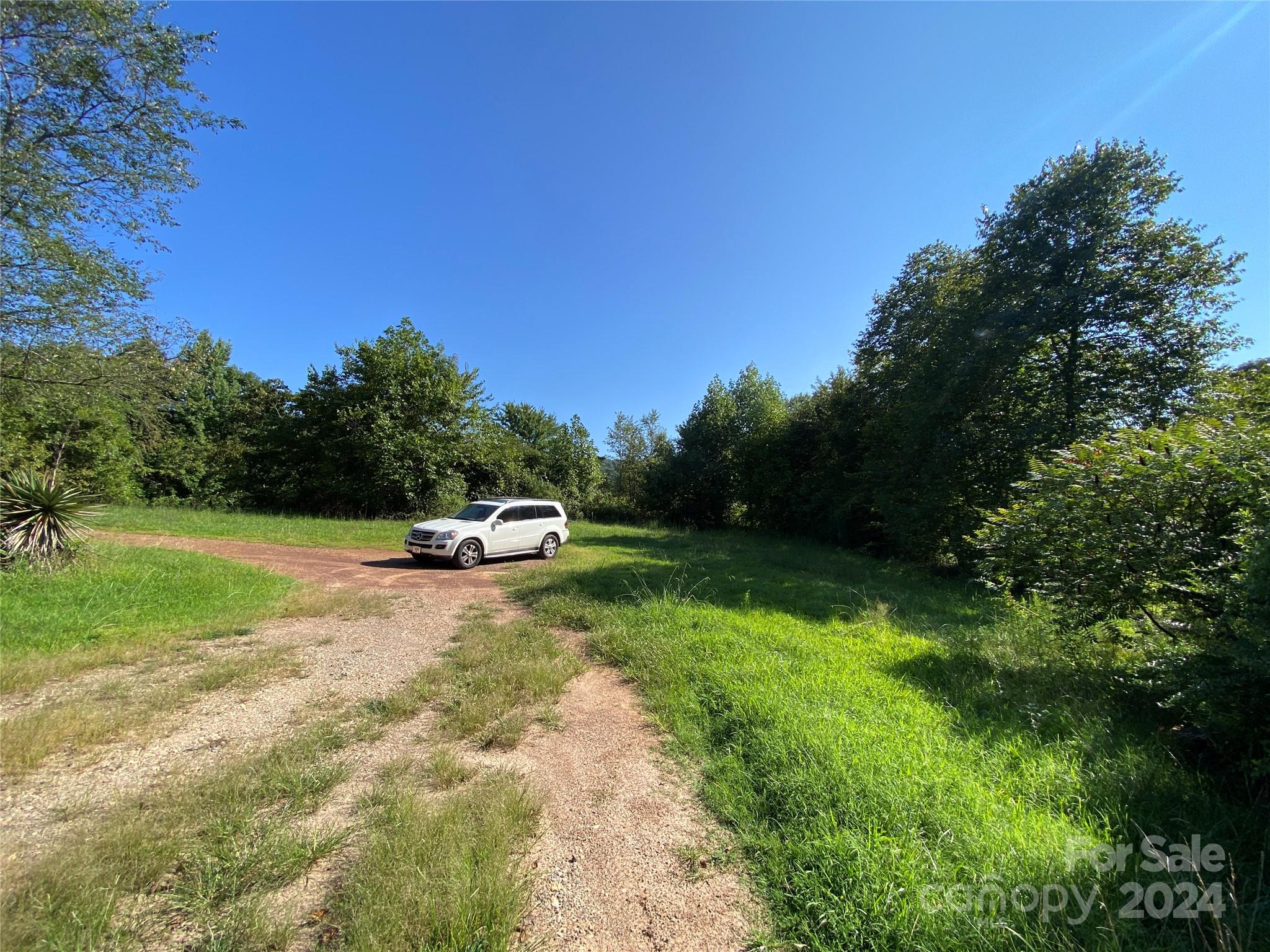 3140 Rutherford College Road Valdese, NC 28690 - Photo 34 of 40 a swimming pool is sitting in the middle of a grassy field