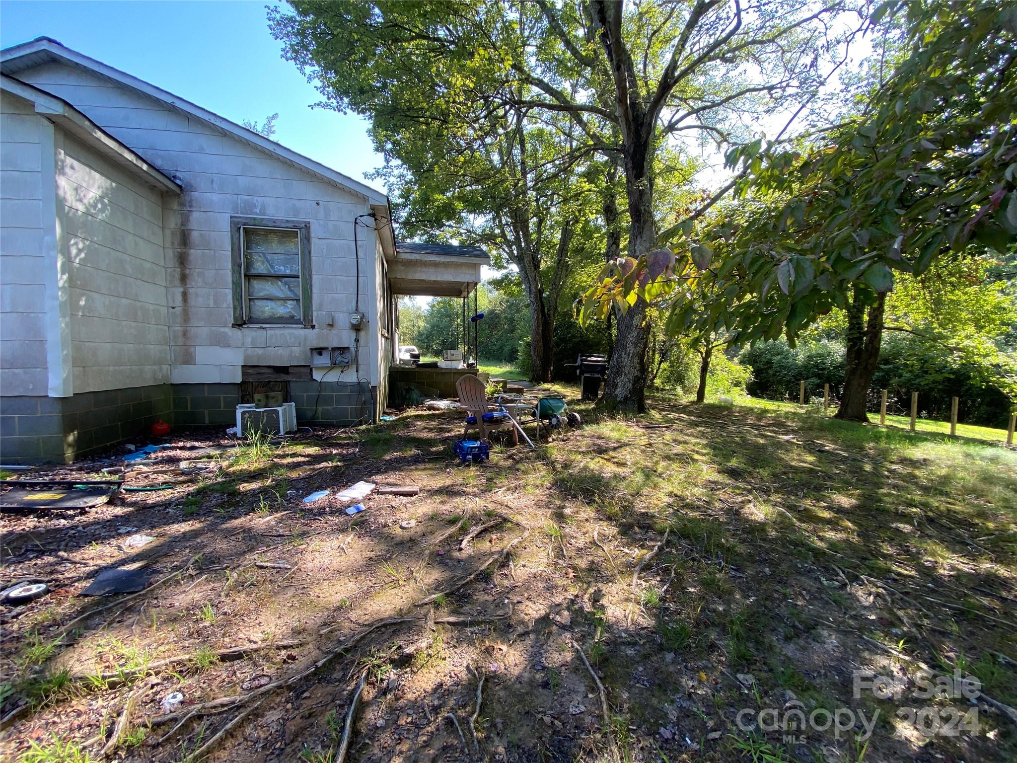 3140 Rutherford College Road Valdese, NC 28690 - Photo 8 of 40 a backyard of a house with table and chairs
