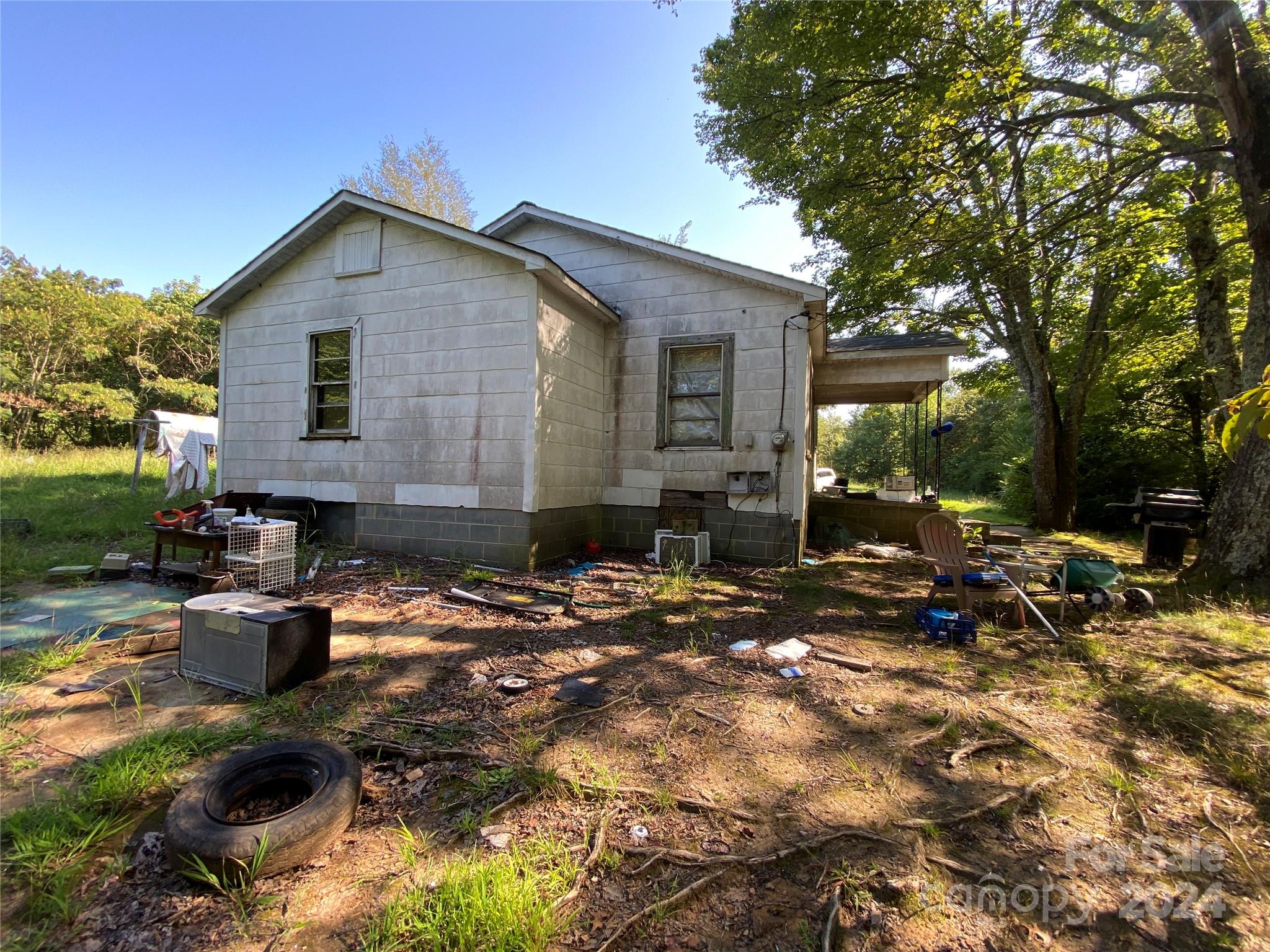 3140 Rutherford College Road Valdese, NC 28690 - Photo 9 of 40 a backyard of a house with fire pit and outdoor seating