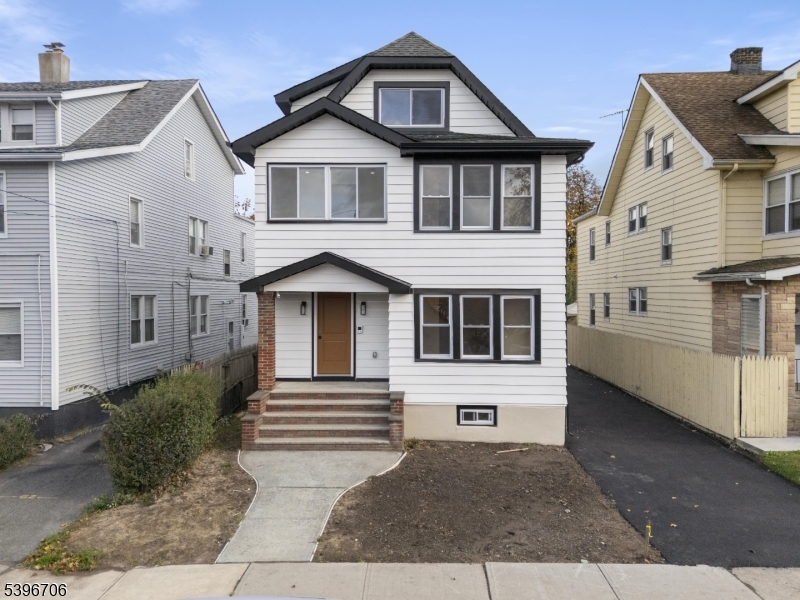 218 Ampere Parkway, Unit 2 Bloomfield, NJ 07003 - Photo 1 of 19 a front view of a house with a yard