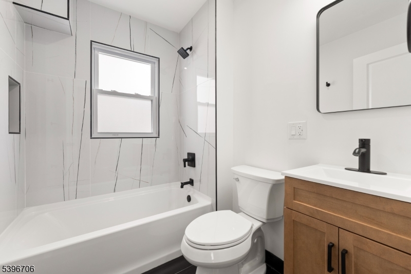 218 Ampere Parkway, Unit 2 Bloomfield, NJ 07003 - Photo 12 of 19 a bathroom with a sink a toilet and a bathtub