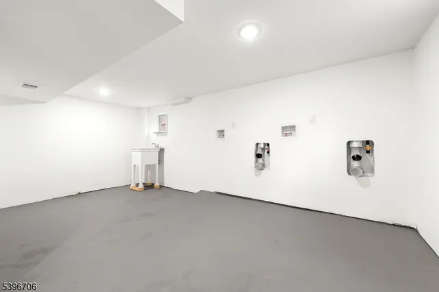 an empty room with shelves