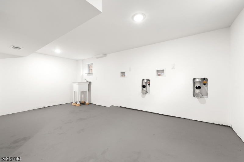 218 Ampere Parkway, Unit 2 Bloomfield, NJ 07003 - Photo 14 of 19 an empty room with shelves