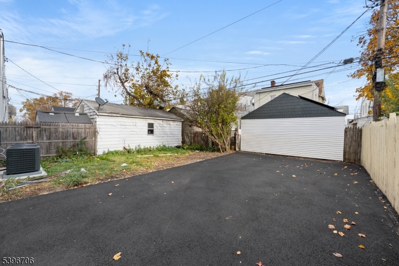 218 Ampere Parkway, Unit 2 Bloomfield, NJ 07003 - Photo 15 of 19 a front view of a house with a yard and garage