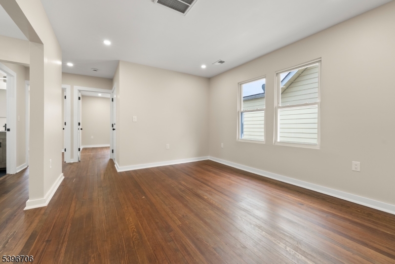 218 Ampere Parkway, Unit 2 Bloomfield, NJ 07003 - Photo 6 of 19 wooden floor in an empty room with a window