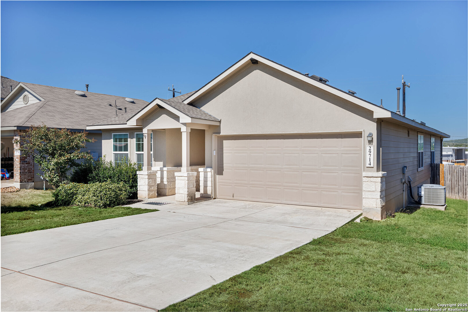 29714 Spring Copper Bulverde, TX 78163 - Photo 3 of 26 a front view of a house with a yard and garage