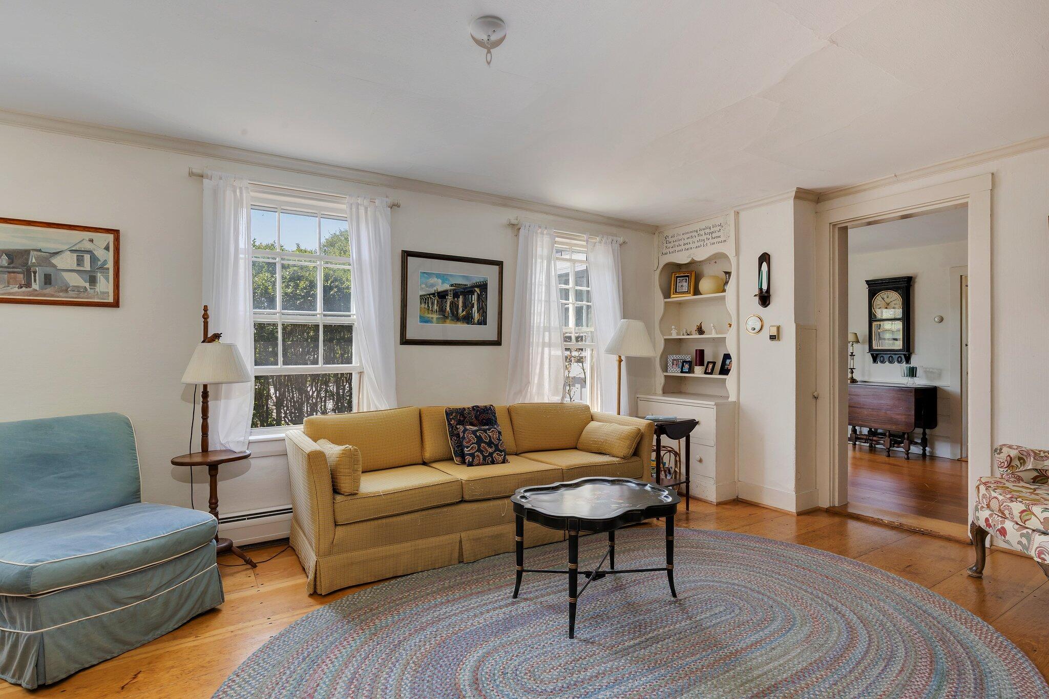 64 Depot Road Truro, MA 02666 - Photo 19 of 53 a living room with furniture and a wooden floor