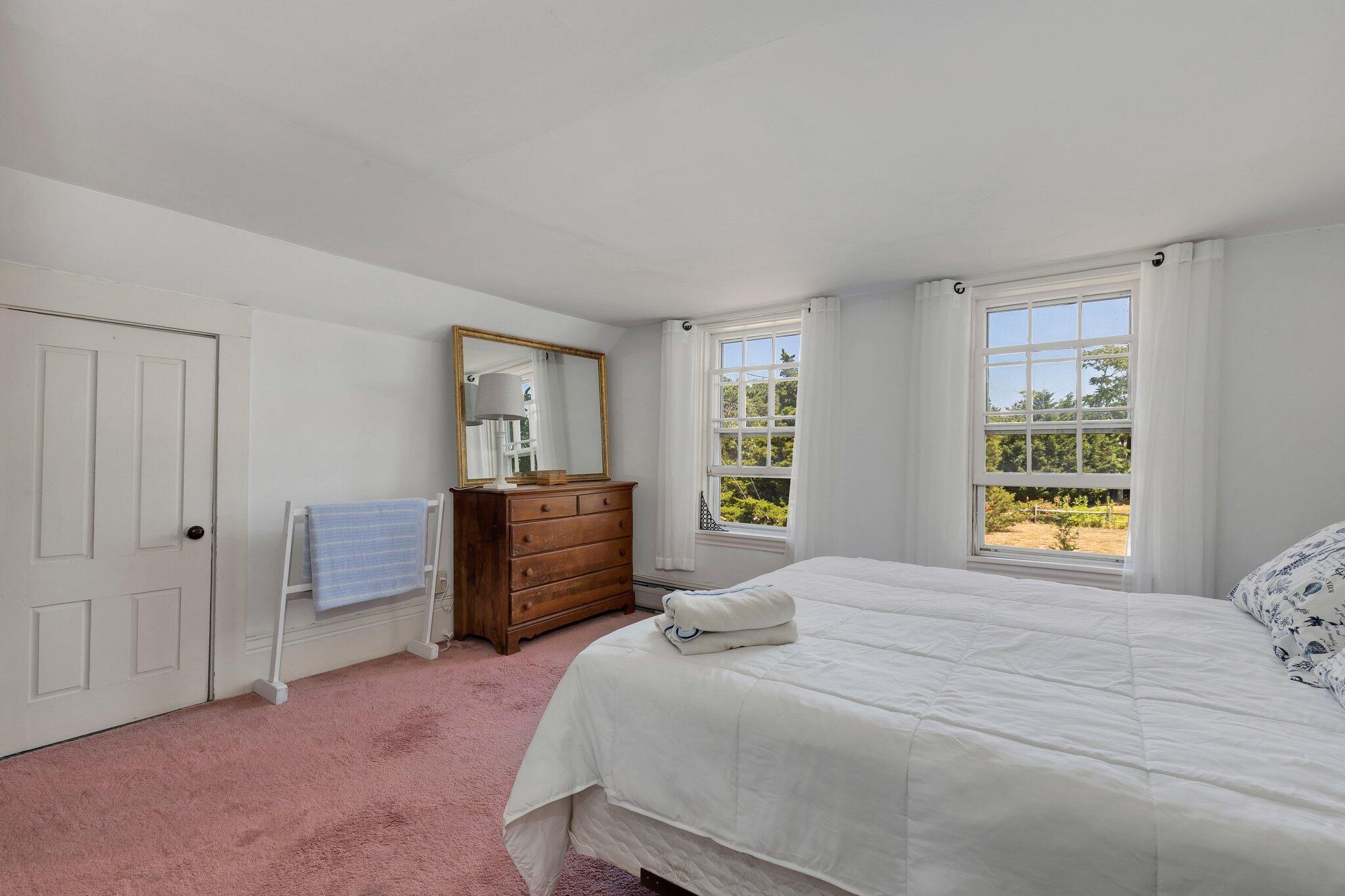 64 Depot Road Truro, MA 02666 - Photo 39 of 53 a bedroom with a bed and a dresser