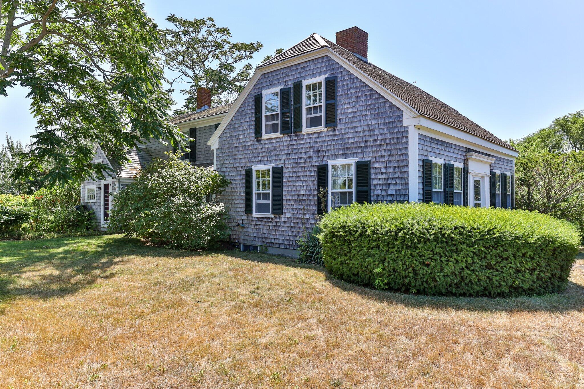 64 Depot Road Truro, MA 02666 - Photo 50 of 53 a front view of a house with a garden